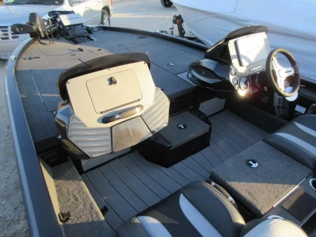 Slide: The Image of 2024 Vexus AVX1880 boat interior with Mercury 115 ProXS engine, showcasing seating and controls. - 16