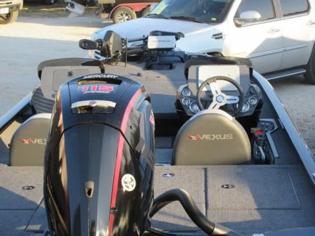 Slide: The Image of 2024 Vexus AVX1880 boat with Mercury 115 ProXS engine, parked outdoors. - 5