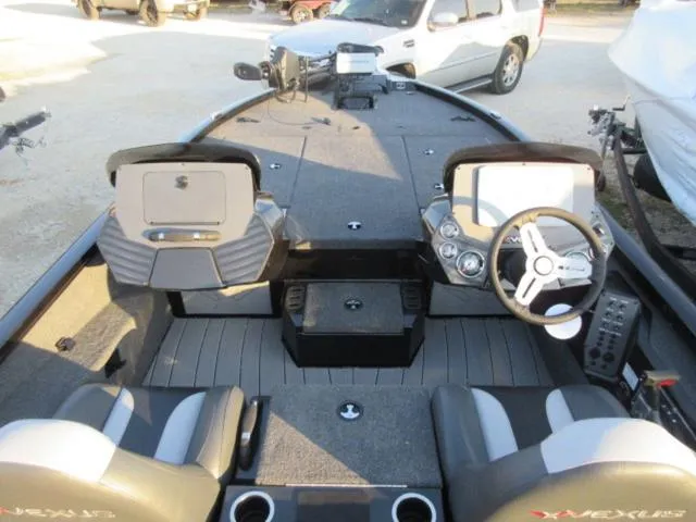 Slide: The Image of 2024 Vexus AVX1880 boat interior with Mercury 115 ProXS engine, featuring dual consoles and seating. - 7