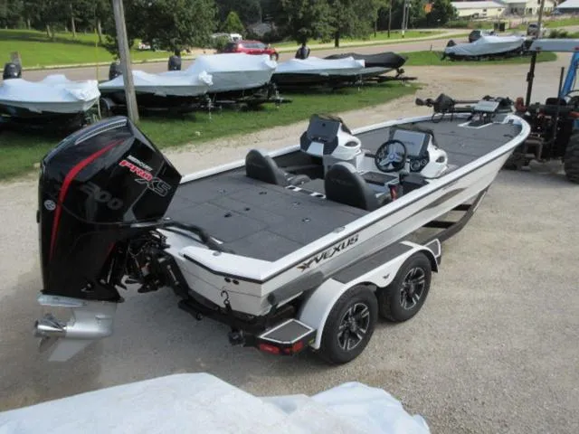 Slide: The Image of 2025 Vexus AVX 2080 boat with 200 Mercury Pro XS engine, parked on a trailer. - 1