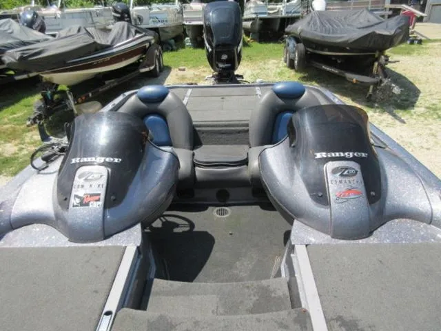Slide: The Image of 2007 Ranger Z20 boat with Mercury 225 Optimax engine, parked among other boats. - 14