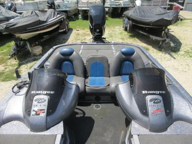 Slide: The Image of 2007 Ranger Z20 boat with Mercury 225 Optimax engine, parked among other boats. - 15