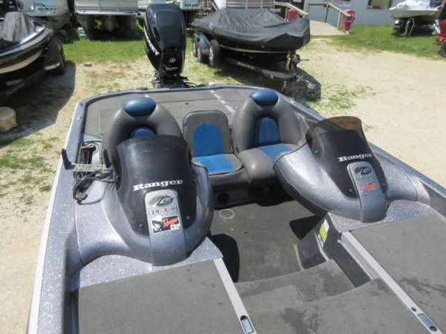 Slide: The Image of 2007 Ranger Z20 boat with Mercury 225 Optimax engine, parked outdoors. - 16