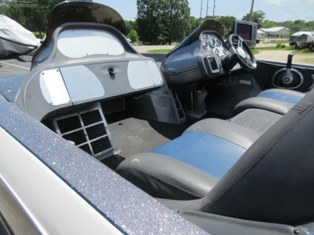 Slide: The Image of 2007 Ranger Z20 boat interior with Mercury 225 Optimax, featuring dual consoles and blue-gray seating. - 8
