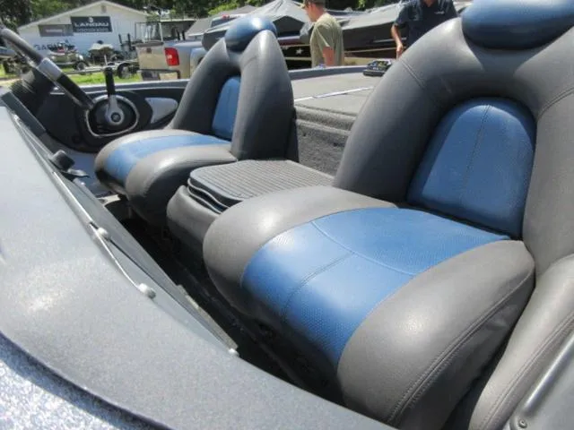 Slide: The Image of 2007 Ranger Z20 boat interior with blue and gray seats, steering wheel visible. - 9