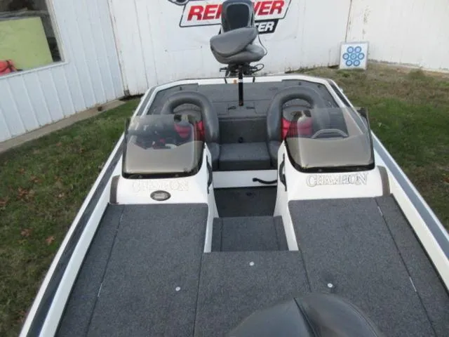 Slide: The Image of 2004 Champion 187 bass boat with Mercury 175Hp outboard, clean and well-maintained interior. - 15