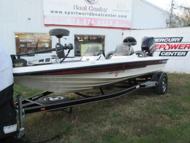 Slide: The Image of 2004 Champion 187 bass boat with Mercury 175Hp outboard, displayed at a boat center. - 5