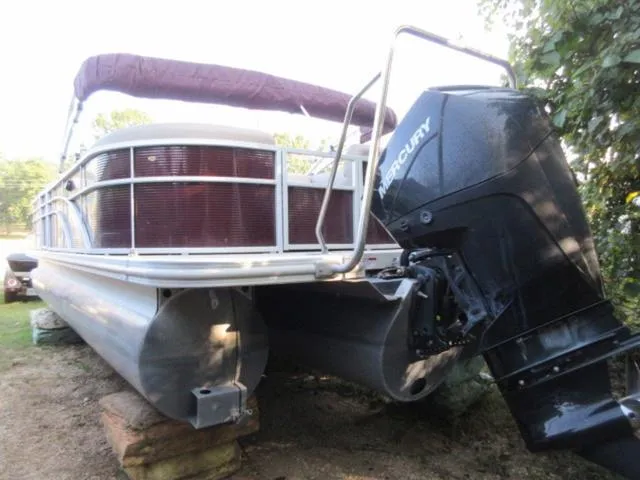 Slide: The Image of 2019 Bennington SX 23 Premier Tritoon with Mercury 225Hp 4Stroke engine, docked on land. - 2