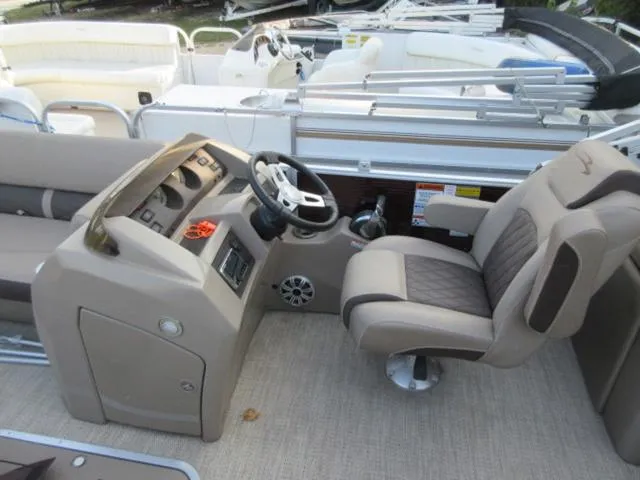 Slide: The Image of 2019 Bennington SX 23 Premier Tritoon interior with steering console and seating. - 3