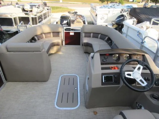 Slide: The Image of 2019 Bennington SX 23 Premier Tritoon interior with seating and helm, featuring Mercury 225Hp engine. - 4