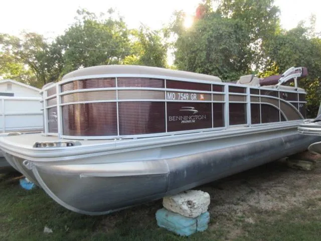 Slide: The Image of Bennington SX 23 Premier Tritoon with 2019 Mercury 225Hp 4Stroke, parked on grass. - 7