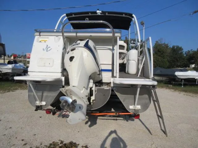 Slide: The Image of 2009 JC 26' Tritoon with 300Hp Evinrude outboard motor, rear view on gravel. - 3