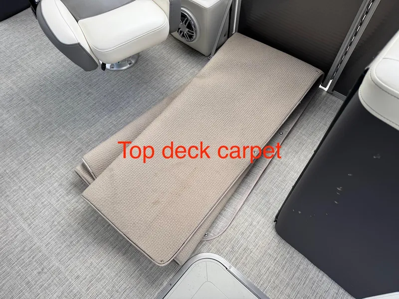 Slide: The Image of 2023 Godfrey Monaco 255 SD boat interior with top deck carpet. - 29