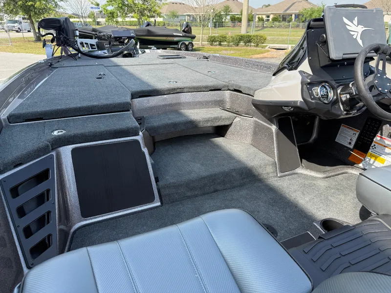 Slide: The Image of 2025 Skeeter ZXR20 boat interior with spacious deck and modern controls. - 9
