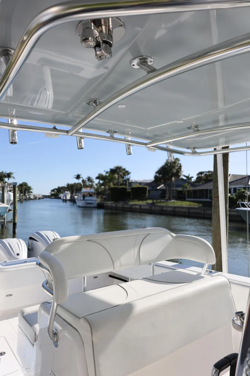 Slide: The Image of 2022 Contender 39 ST boat interior with sleek design, docked in a scenic waterfront location. - 15