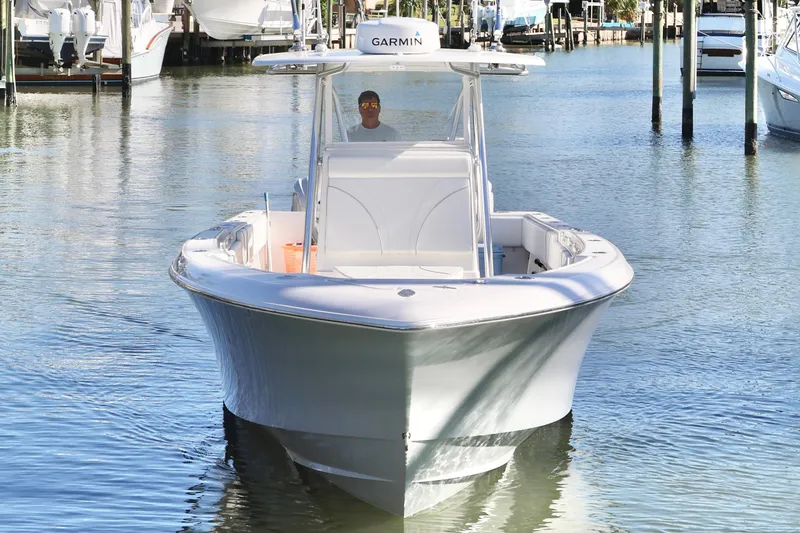 Slide: The Image of 2022 Contender 39 ST boat on calm water, front view. - 5