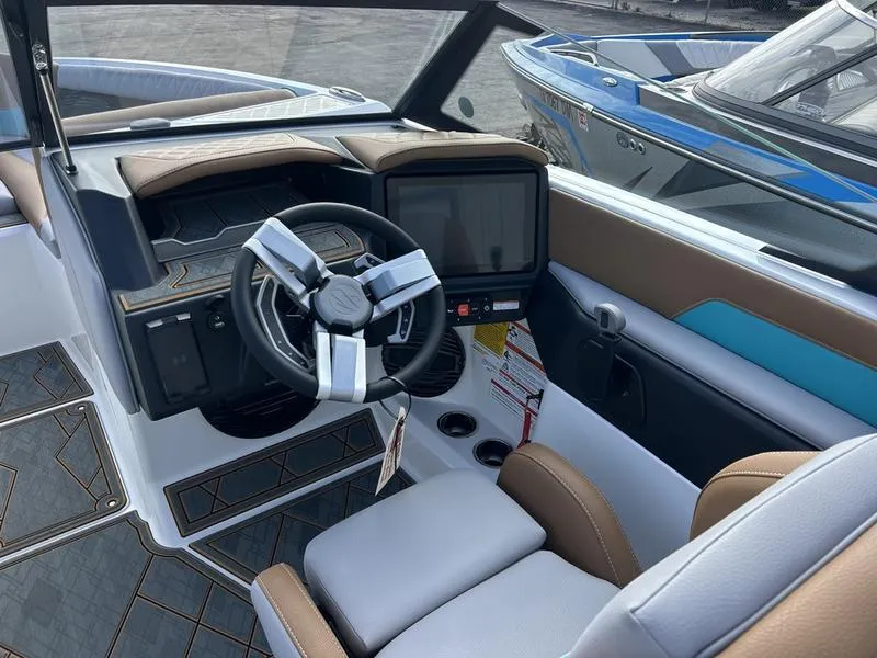 Slide: The Image of 2025 Tigé Z3 boat interior with modern steering wheel and dashboard. - 4