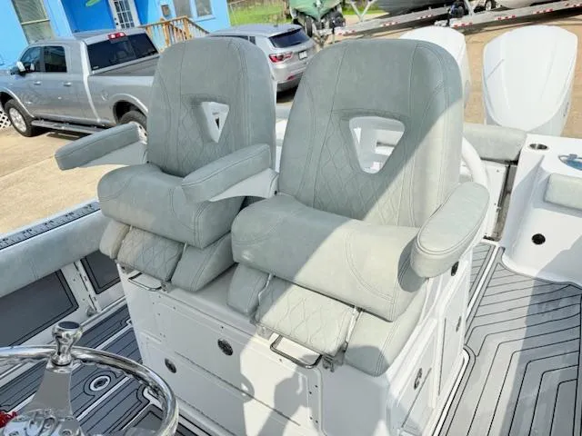Slide: The Image of 2019 Sportsman Open 282TE Center Console boat seats with armrests and modern design. - 10