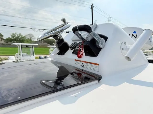 Slide: The Image of 2019 Sportsman Open 282TE Center Console helm with steering wheel and controls. - 15