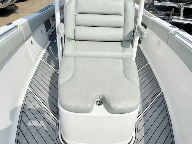Slide: The Image of 2019 Sportsman Open 282TE Center Console boat with cushioned seating and sleek deck design. - 4