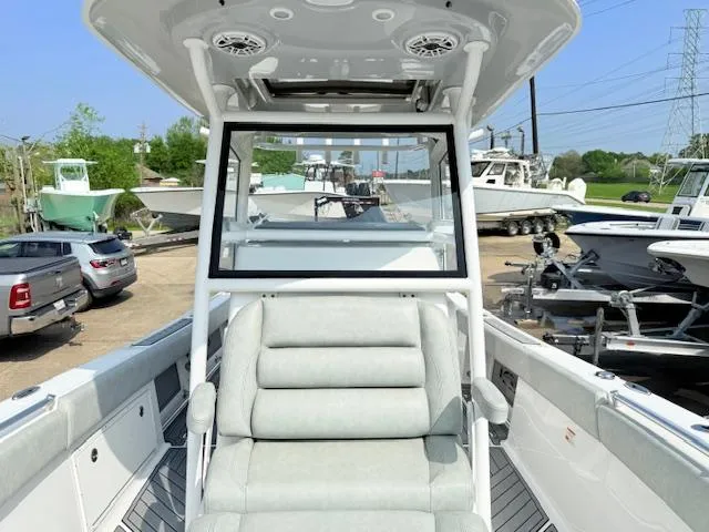 Slide: The Image of 2019 Sportsman Open 282TE Center Console boat interior with seating and console view. - 5