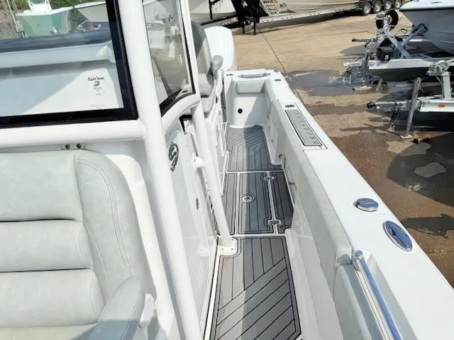 Slide: The Image of 2019 Sportsman Open 282TE Center Console boat with sleek deck design. - 9