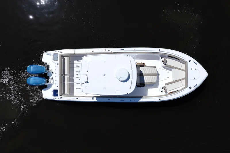 Slide: The Image of Aerial view of 2024 Everglades 315CC boat with dual engines on dark water. - 20