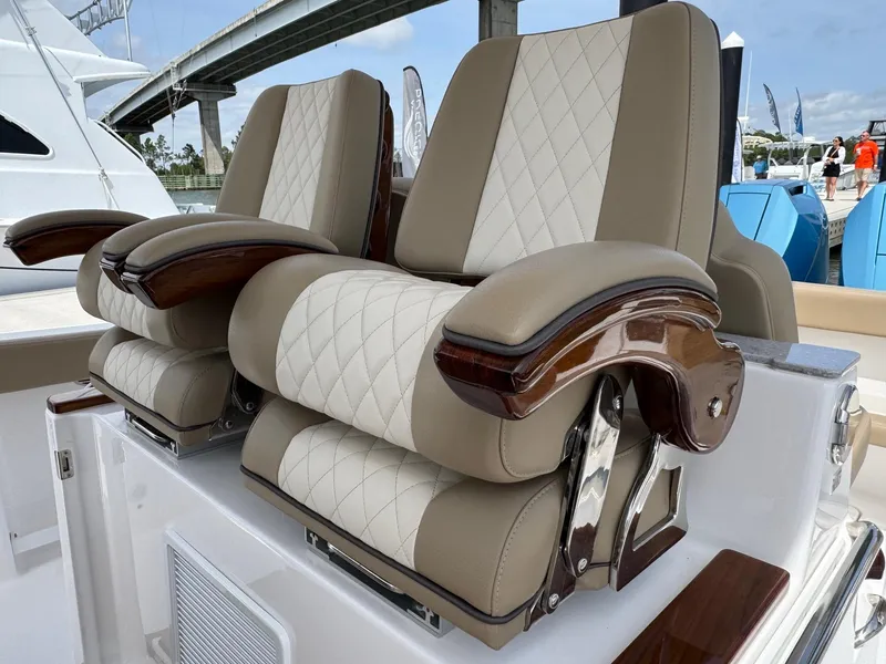 Slide: The Image of Luxurious seating on 2024 Everglades 315CC boat, featuring elegant beige and white upholstery. - 33