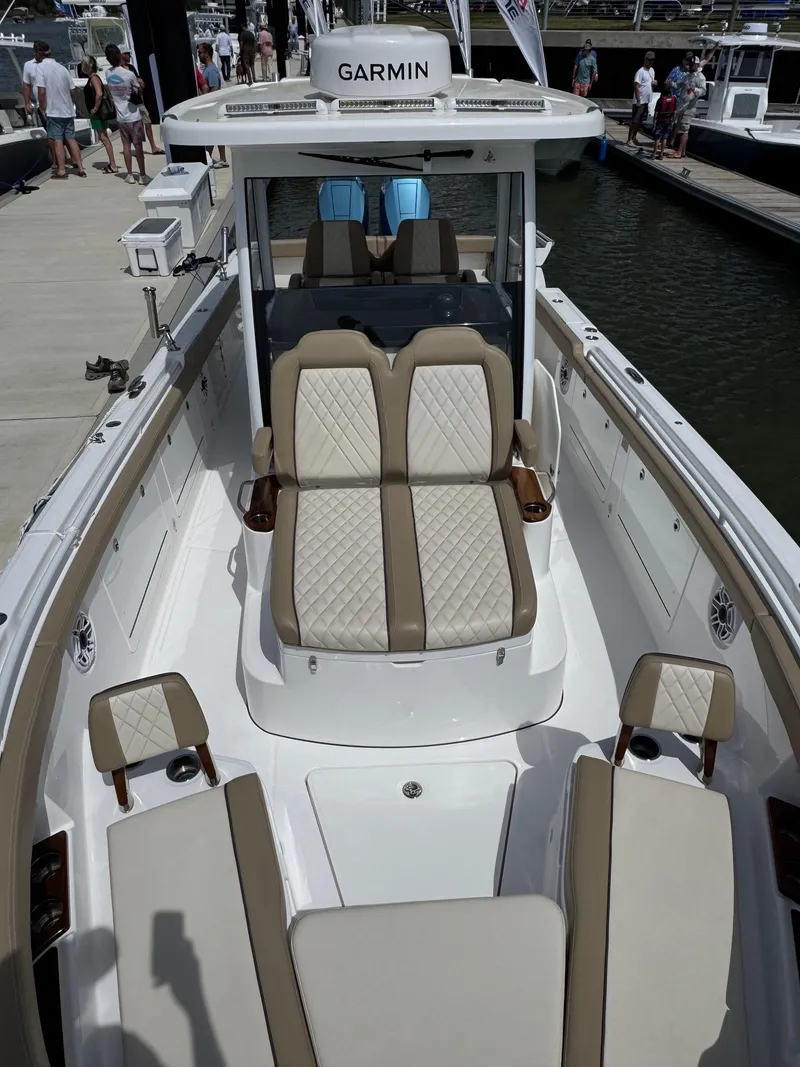 Slide: The Image of 2024 Everglades 315CC boat with luxurious seating and Garmin navigation system. - 38
