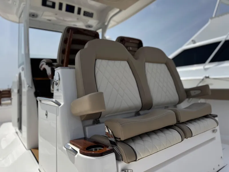 Slide: The Image of 2024 Everglades 315CC boat interior with luxurious seating and modern design. - 40
