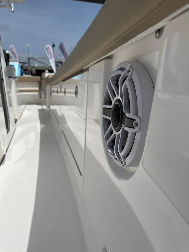 Slide: The Image of 2024 Everglades 315CC boat deck with speaker detail, showcasing sleek design and craftsmanship. - 44