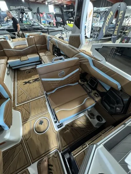 Slide: The Image of 2024 Tigé Ultré 25ZX boat interior with luxurious seating and modern design. - 3