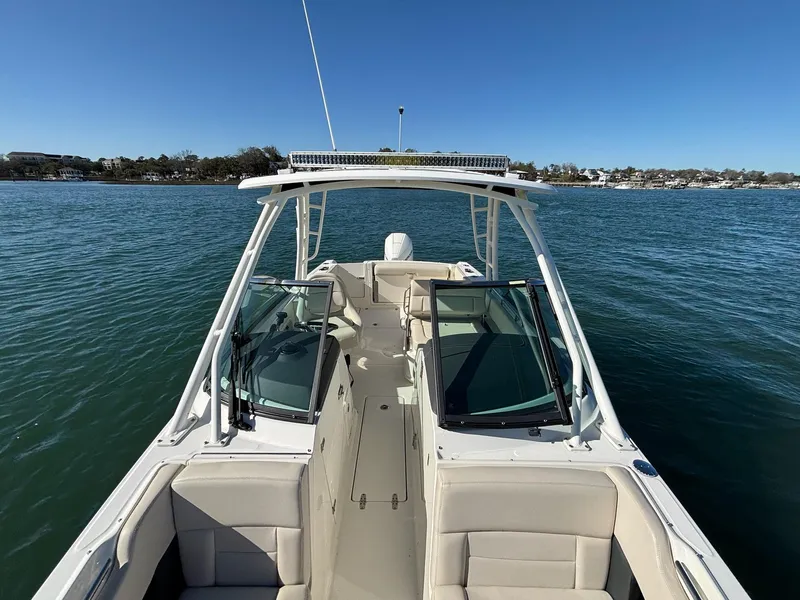 Slide: The Image of 2018 Boston Whaler 230 Vantage boat on calm water, clear sky background. - 11