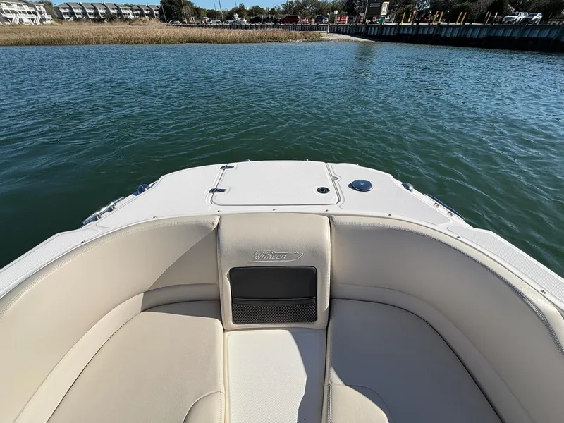 Slide: The Image of 2018 Boston Whaler 230 Vantage boat interior with water view. - 12