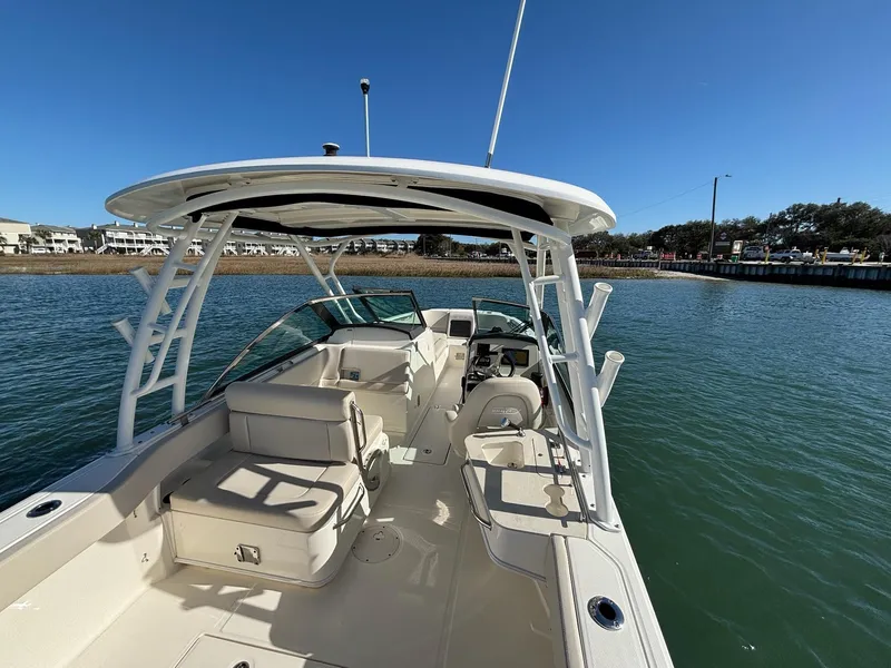 Slide: The Image of 2018 Boston Whaler 230 Vantage boat cruising on a calm lake. - 5