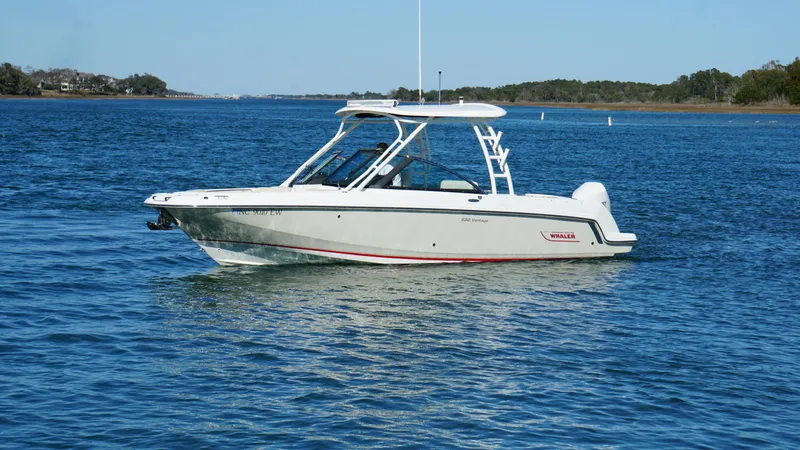 Slide: The Image of 2018 Boston Whaler 230 Vantage boat on calm water, side view. - 6