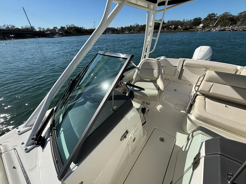 Slide: The Image of 2018 Boston Whaler 230 Vantage boat interior on calm water. - 7