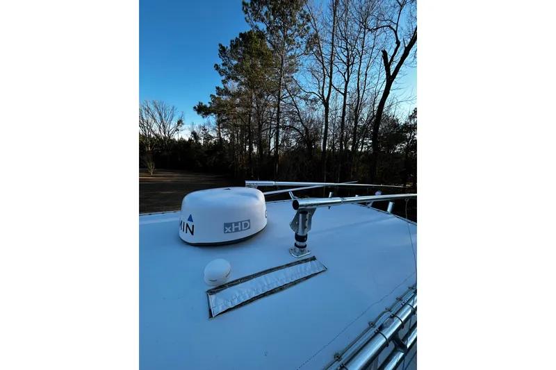 Slide: The Image of Rooftop view of a 2015 Contender 25 Tournament boat with radar and antenna. - 48