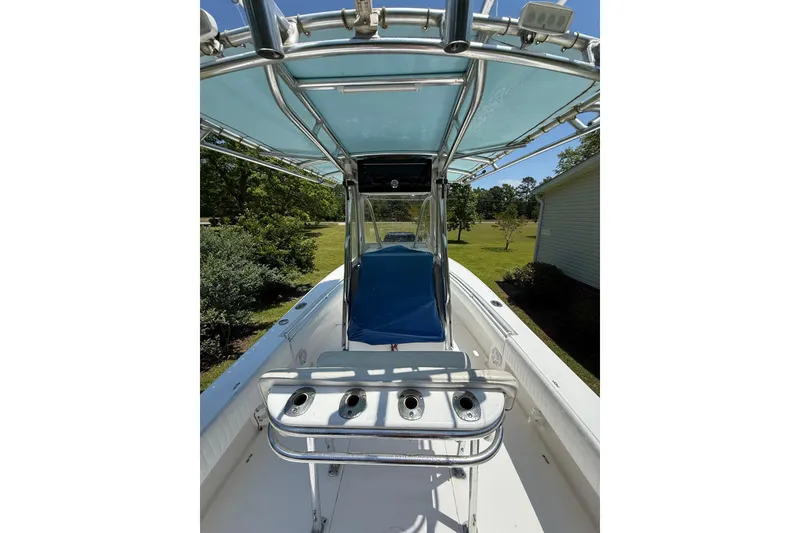 Slide: The Image of 2015 Contender 25 Tournament boat with blue canopy and rod holders. - 53