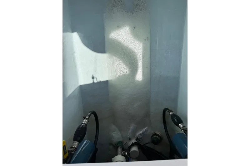 Slide: The Image of Bilge area of a 2015 Contender 25 Tournament boat with hoses and fittings. - 56