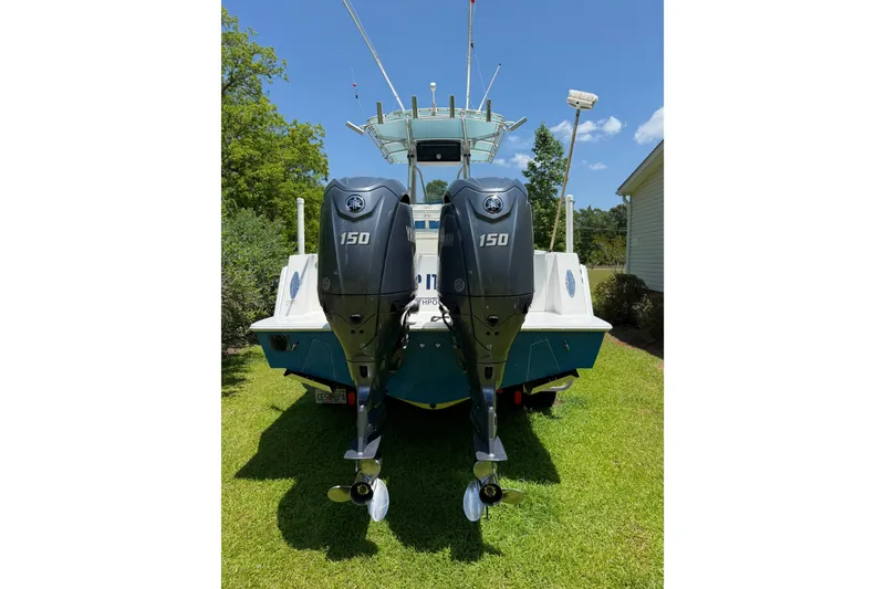 Slide: The Image of 2015 Contender 25 Tournament boat with dual 150 horsepower outboard engines. - 57