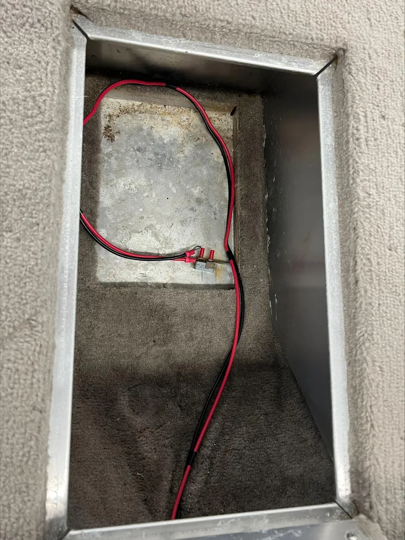 Slide: The Image of 2005 Starcraft Wb 16 D-Star compartment with exposed wiring. - 4