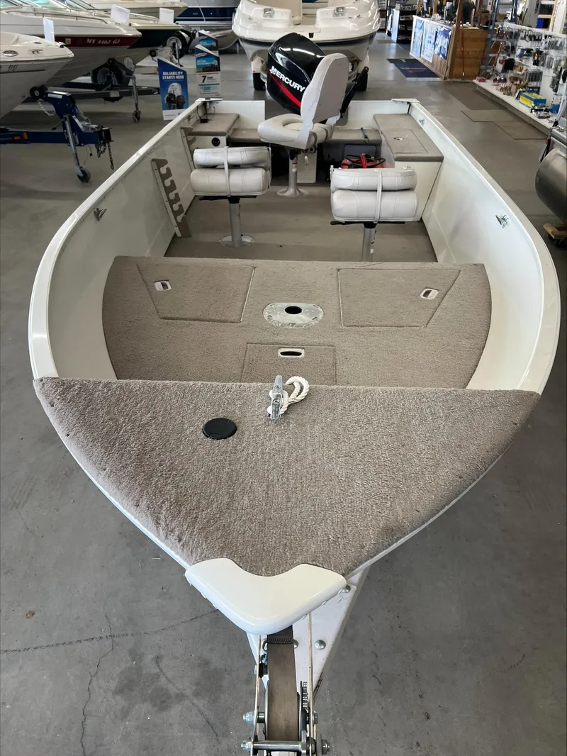 Slide: The Image of 2005 Starcraft Wb 16 D-Star boat interior with seating and carpeted deck. - 9