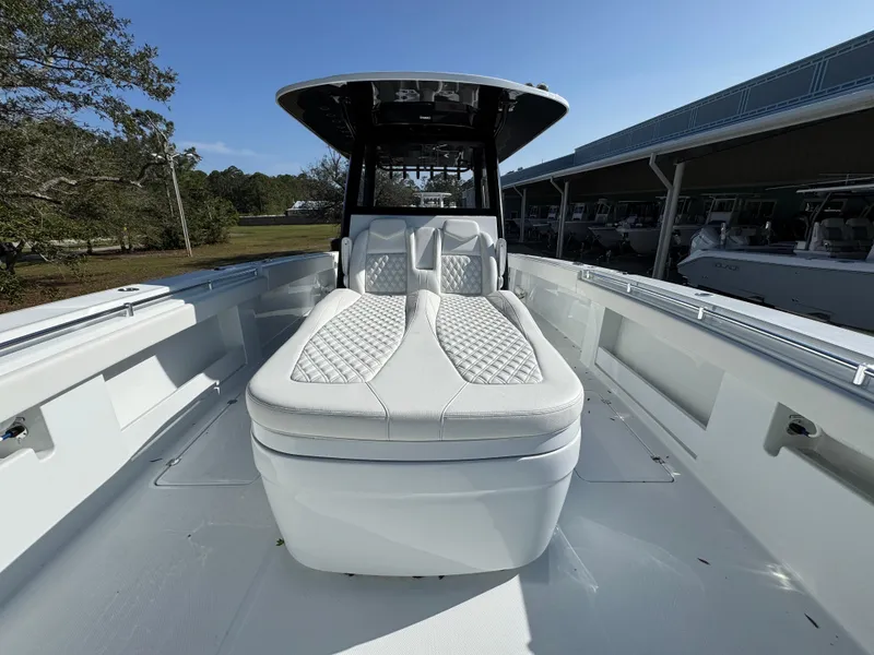 Slide: The Image of 2025 Invincible 38 Catamaran with luxurious seating and sleek design. - 19