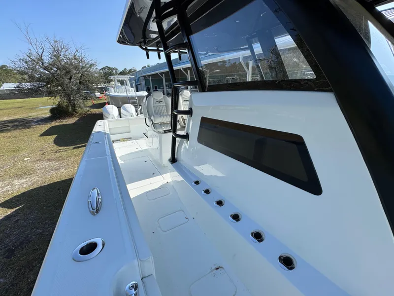 Slide: The Image of 2025 Invincible 38 Catamaran, sleek deck design, spacious layout, modern features. - 22