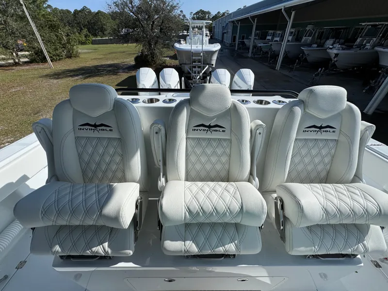 Slide: The Image of 2025 Invincible 38 Catamaran with luxurious seating and sleek design. - 24