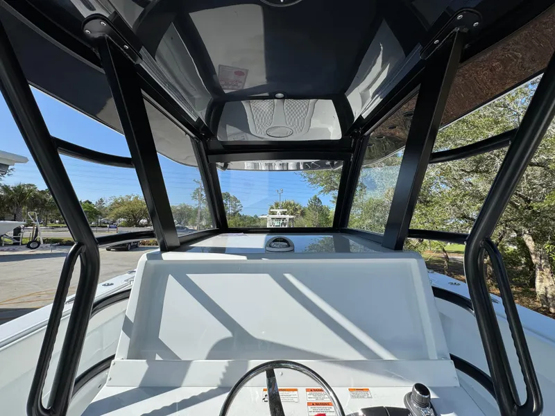 Slide: The Image of 2025 Invincible 38 Catamaran helm view with modern design and clear canopy. - 7
