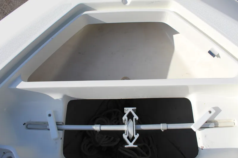 Slide: The Image of 2016 SeaVee 340Z boat anchor storage compartment with rope and securing mechanism. - 23