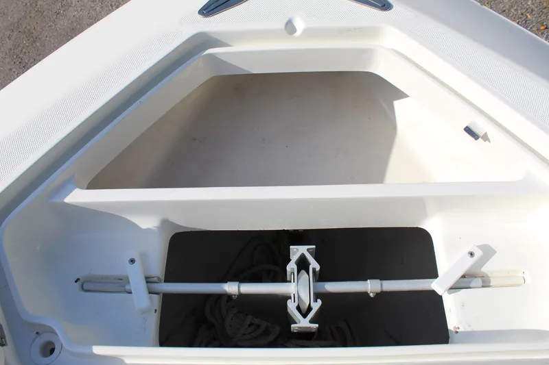 Slide: The Image of 2016 SeaVee 340Z boat anchor storage compartment with anchor and rope. - 24