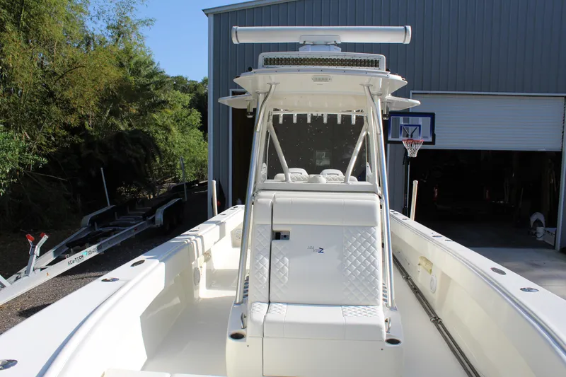 Slide: The Image of 2016 SeaVee 340Z boat with center console, parked near a garage. - 26